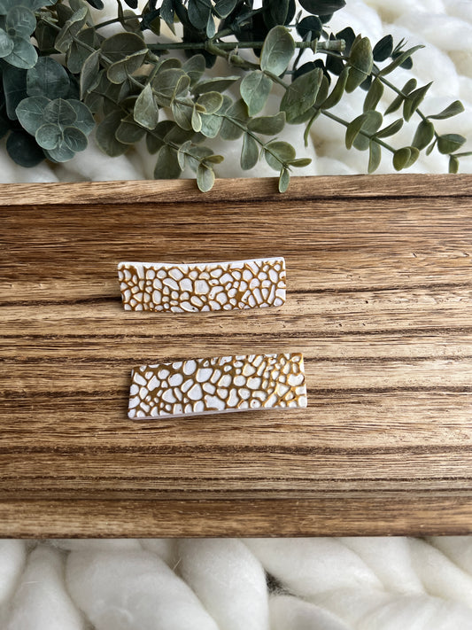 White and gold barrette